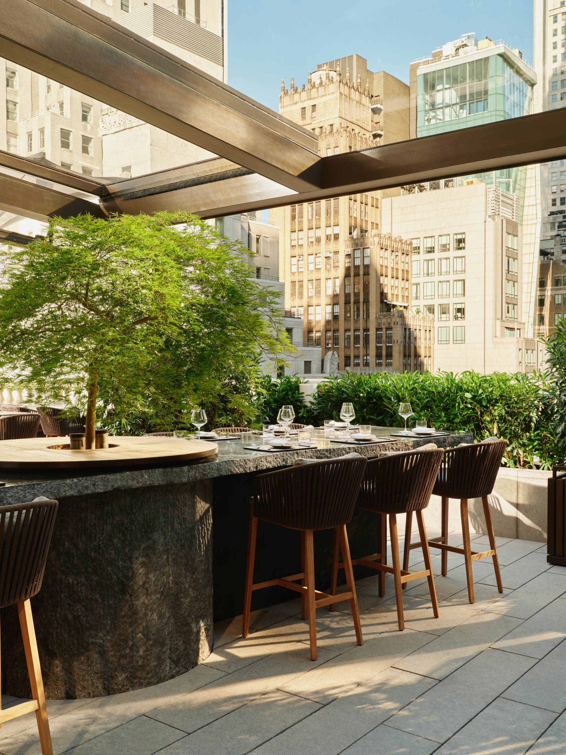 Garden terrace bar at Aman New York in Effect Magazine