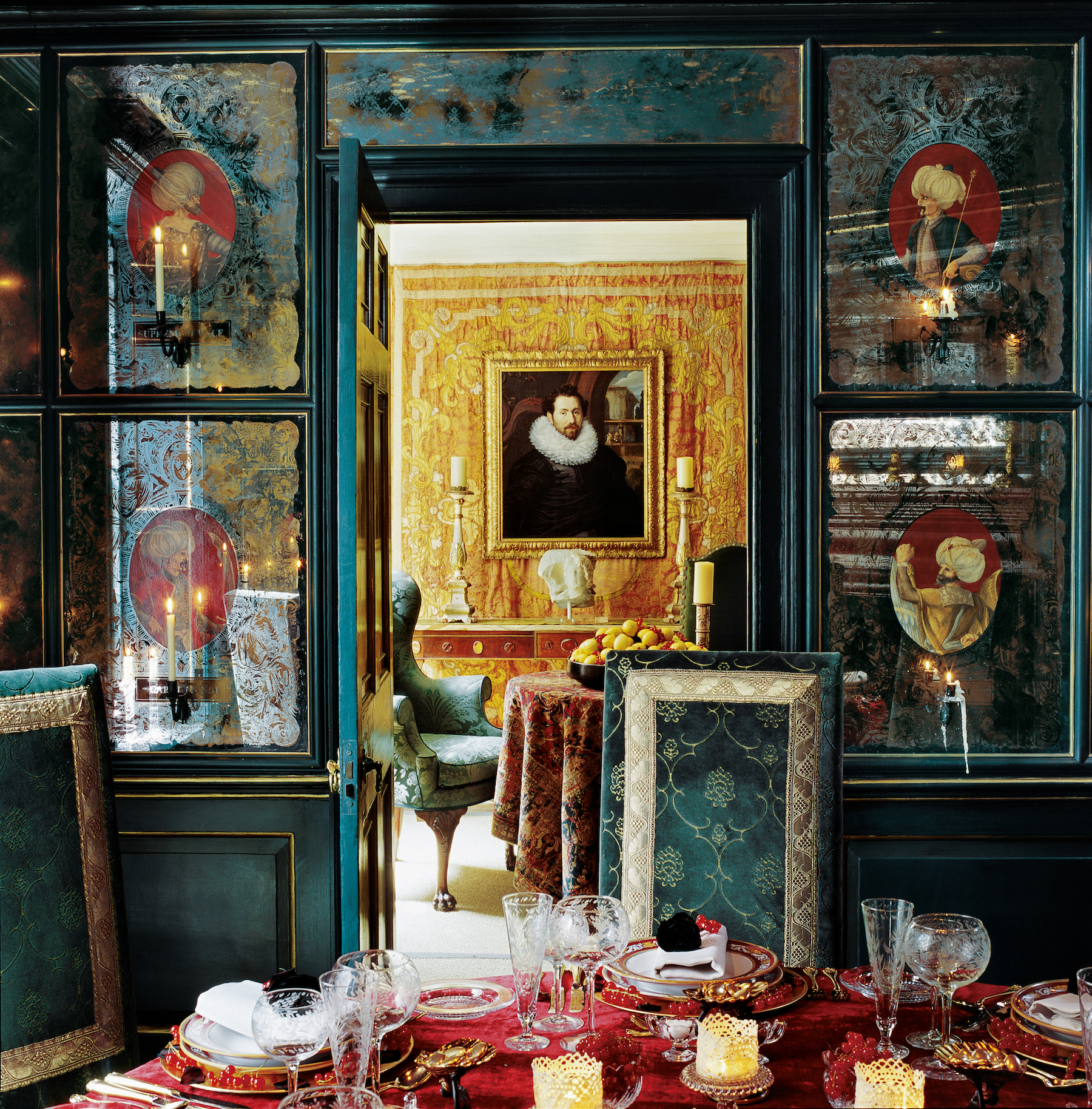 An Ottoman-style dinning room created by interior designer Alidad with reproduction verre églomisé panels and antiqued painted wood walls in Effect Magazine