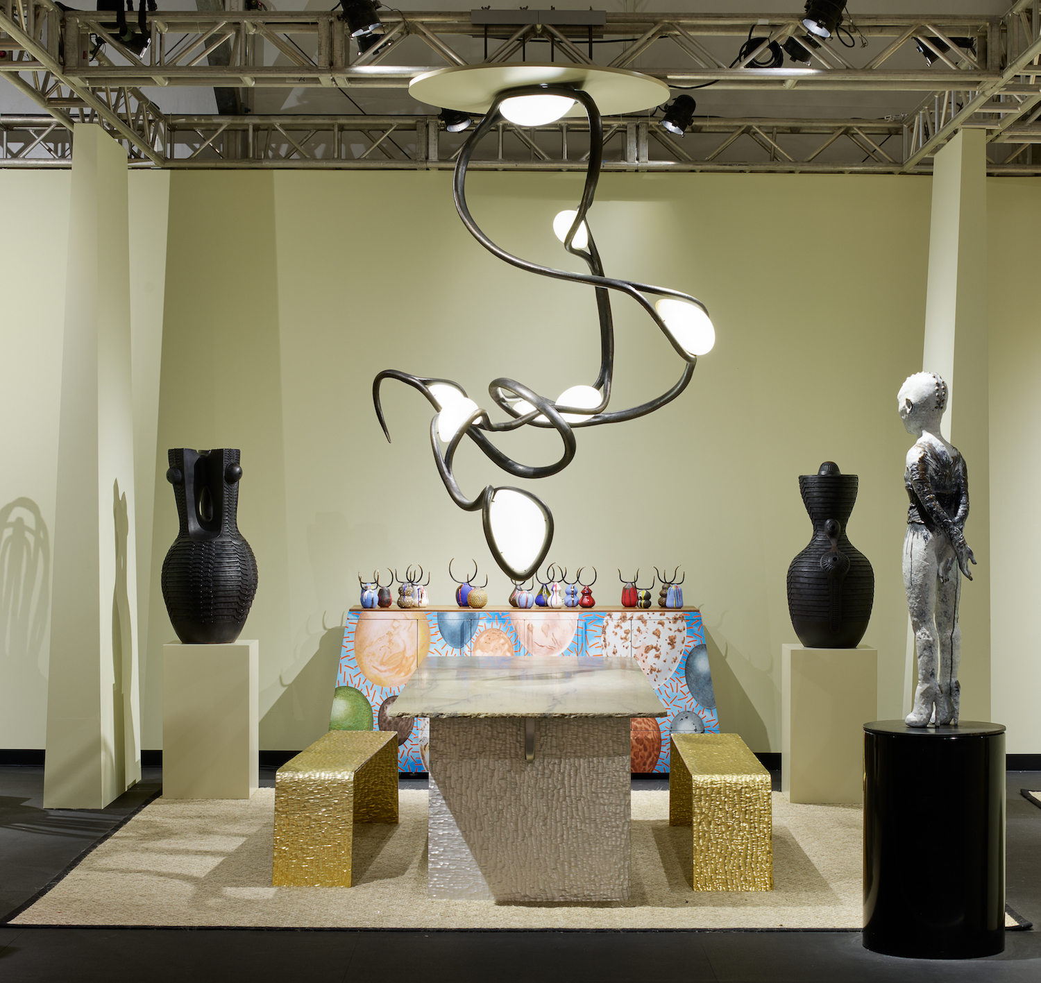 Southern Guild booth at Design Miami 2022 with Rich Mnisi’s Nyoka console and Vutlhari chandelier in Effect Magazine