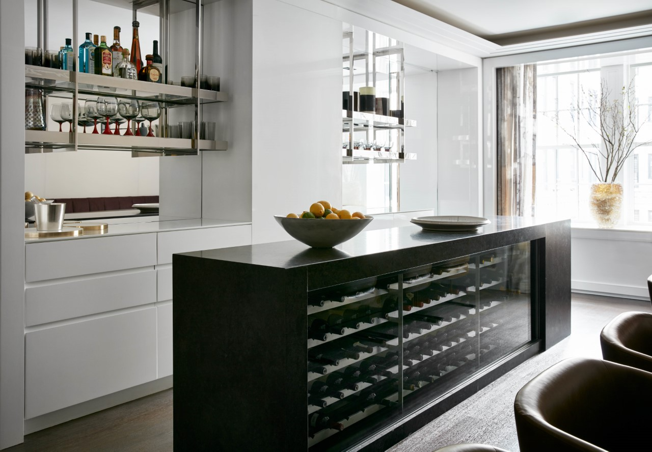 A kitchen incorporating a statement wine display by interior design firm Pembrooke & Ives in Effect Magazine