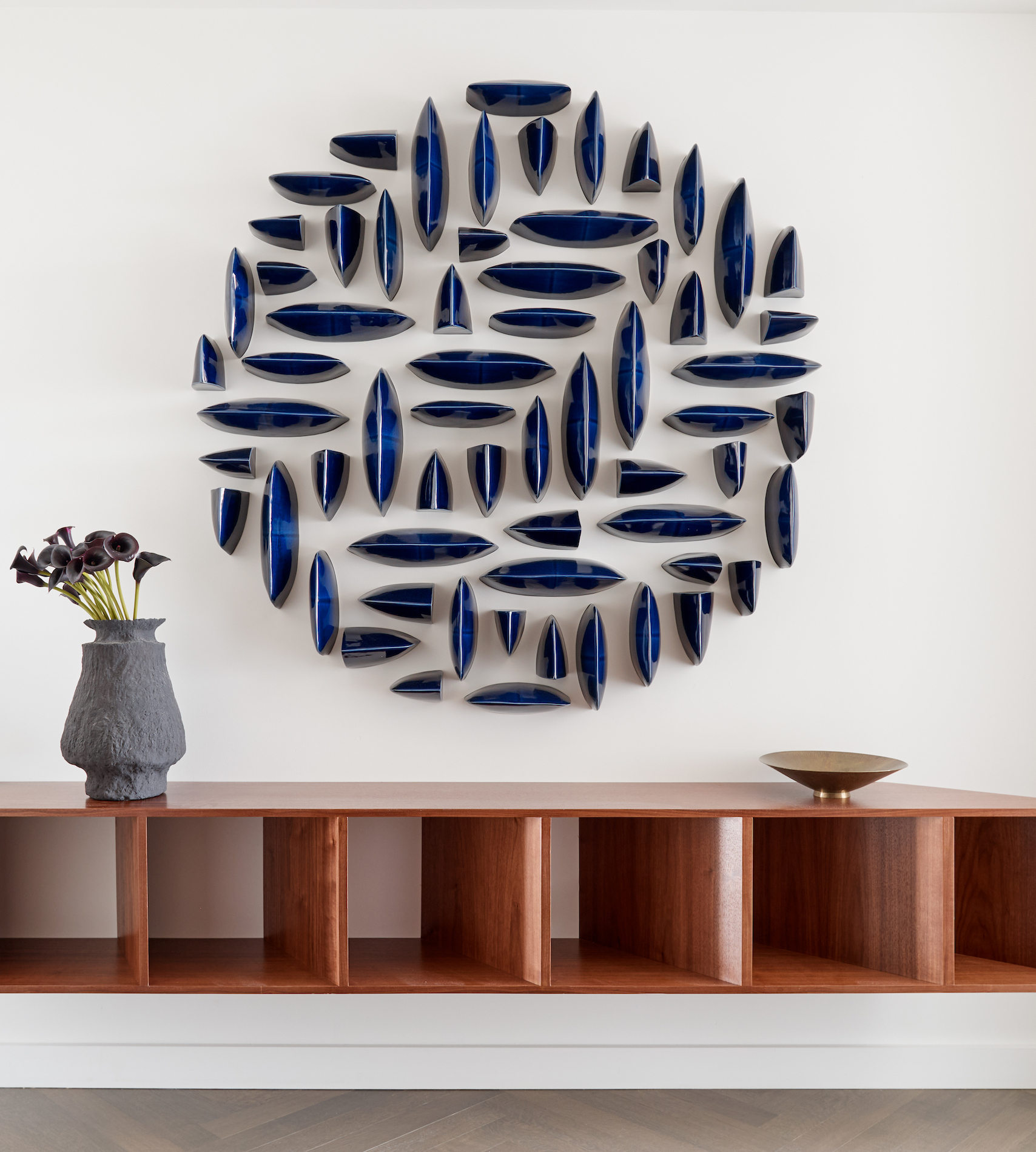 Ceramic wall art in a Tribeca penthouse in New York interior designed by Jessica Gersten in Effect Magazine