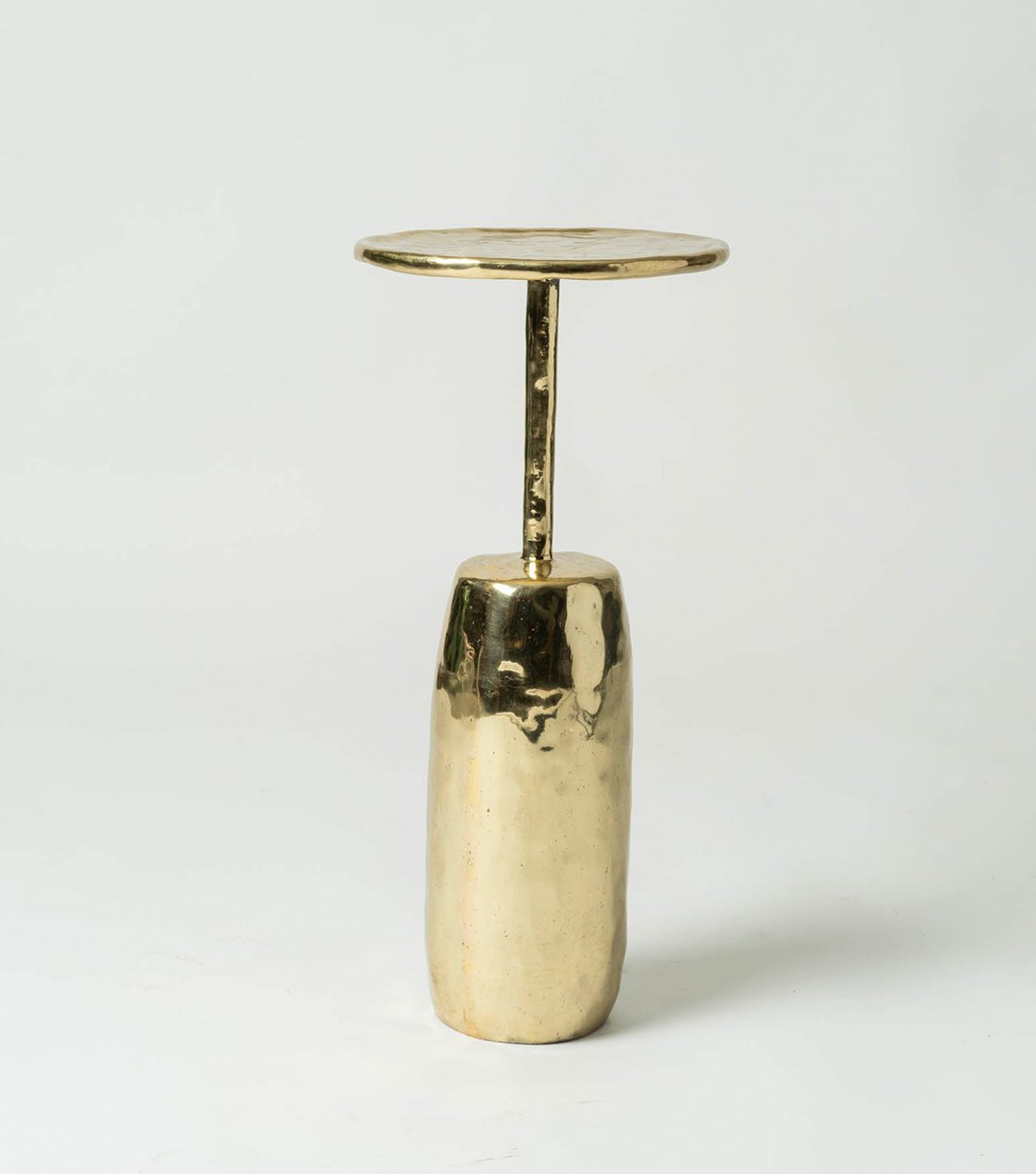 Sand-case Brass Cocktail Table designed by the Ravi Vazirani Design Studio in Effect Magazine