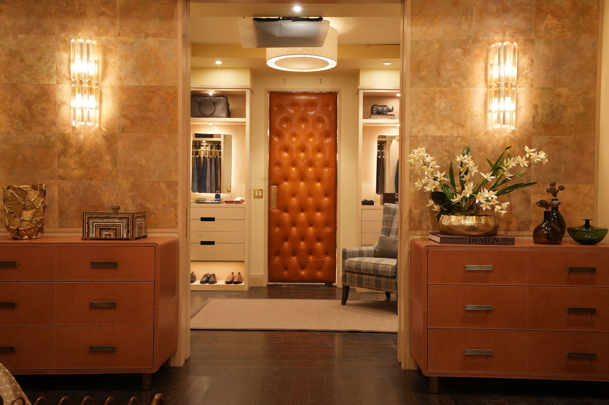 The walk-in closet in Lisa Todd Wexley’s (Nicole Ari Parker) apartment in “And Just Like That…”, with caramel button-tufted leather swinging door to separate the “his and her” spaces – Effect Magazine
