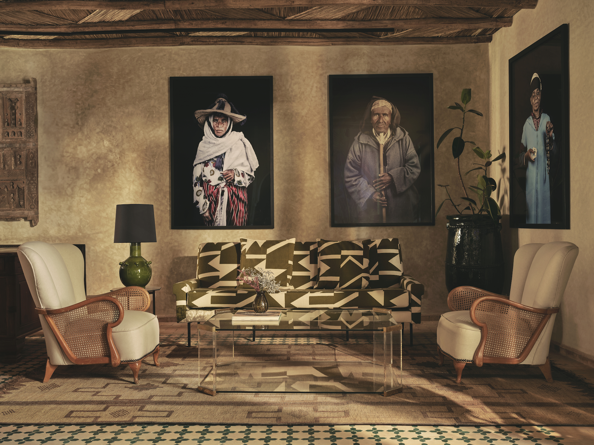 The reception area of Izza hotel in Marrekesh with works from the Les Marocains series by Leila Alaoui - Effect Magazine